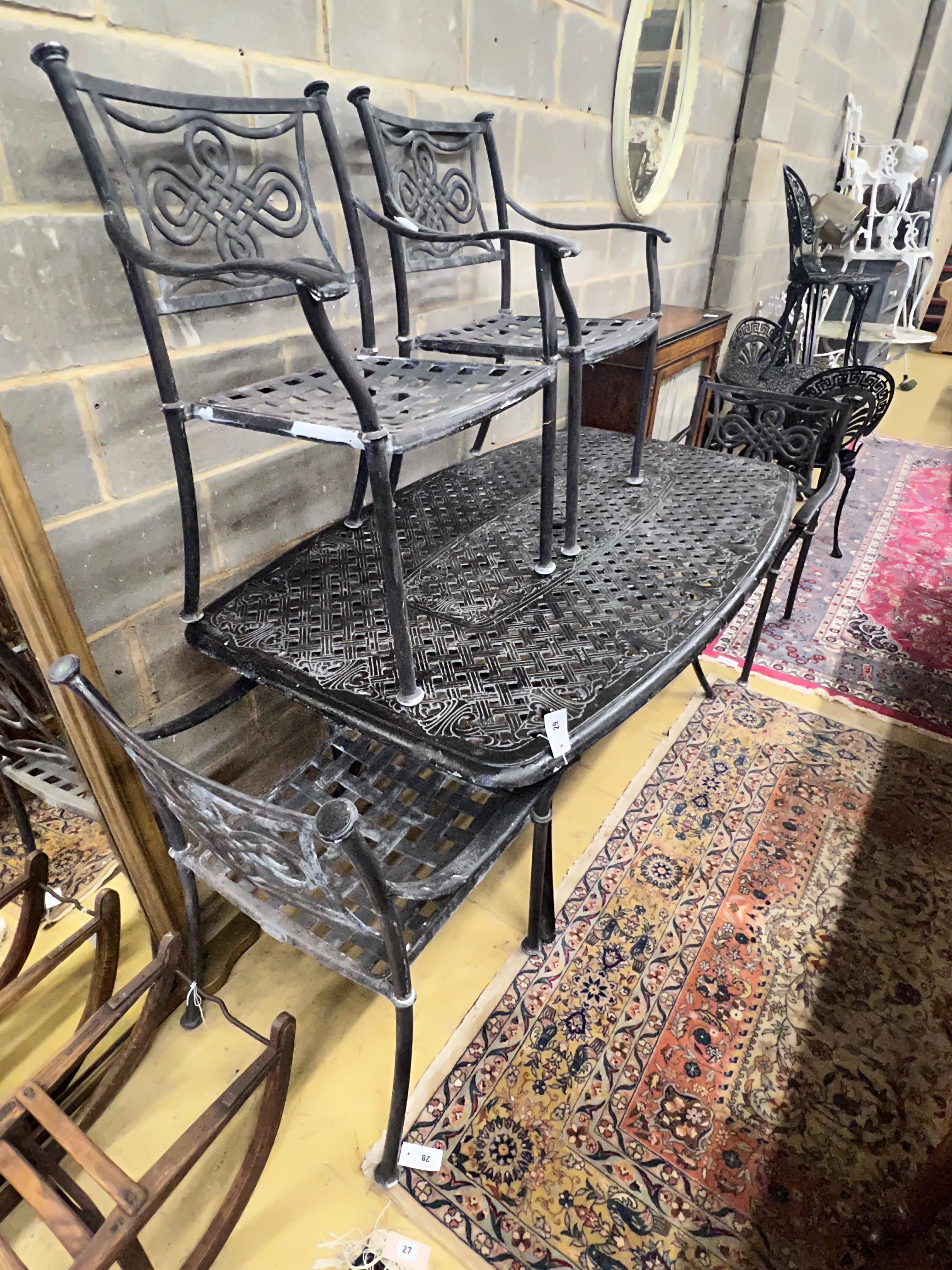 A rectangular painted aluminium garden table, length 164cm, depth 96cm, height 71cm and four similar elbow chairs